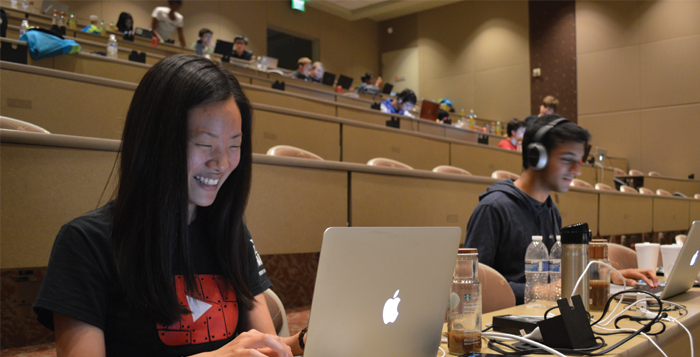 Photo by Jenna Kingsley College senior Christal Wang (left) and Georgia Institute of Technology sophomore Kush Patel (right) worked on   their app, PhotoSinc, Saturday night at the Emory Hackathon. 