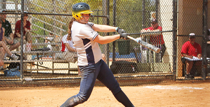 Courtesy of Emory Athletics Senior first baseman Megan Light knocks a ball into play. Light had five RBIs in the first game of a Saturday doubleheader against Maryville College (Tenn.). The Eagles won the first game of the doubleheader 10-1, and lost the second 4-0. The team is now waiting to hear their postseason fate.