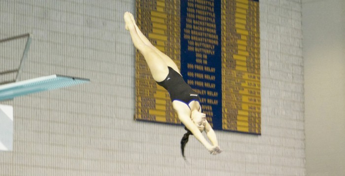 Freshman Mara Rosenstock dives into the Woodruff Physical Education Center (WoodPEC) pool. She secured NCAA qualifying scores in the one-meter and three-meter events last Saturday. Photo Courtesy of Emory Athletics.